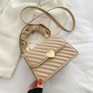 Elegant Cream Quilted Handbag